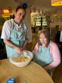 Stephani Carter Wellbeing Coordinator and Maren Robson Resident scaled e1716557079599